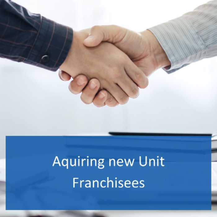 Handshake of two men closing the deal on a new unit franchise
